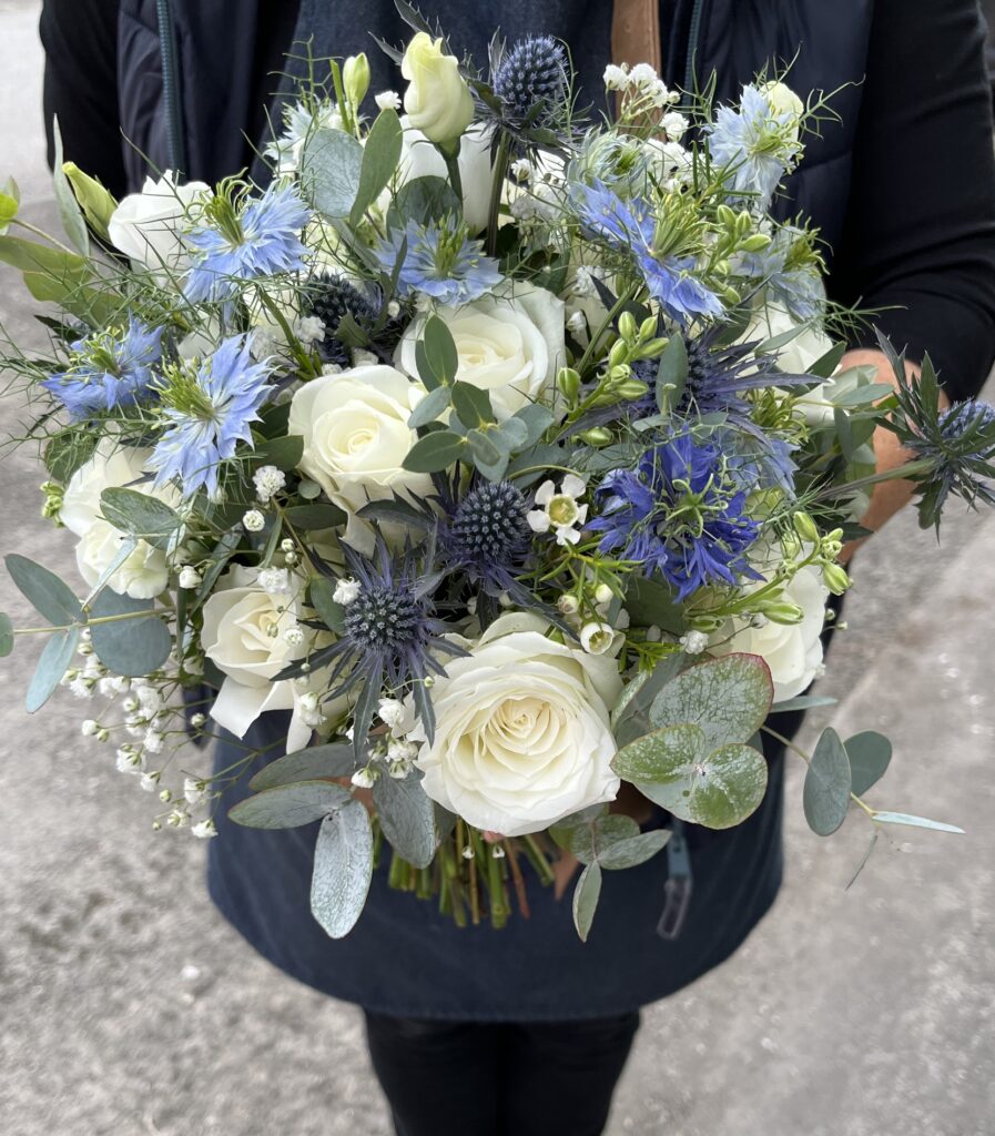 Blue and white wedding flower display