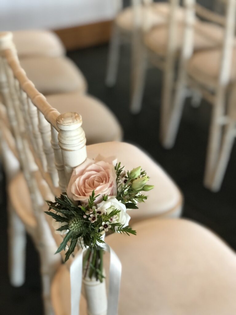 Chair aisle flowers
